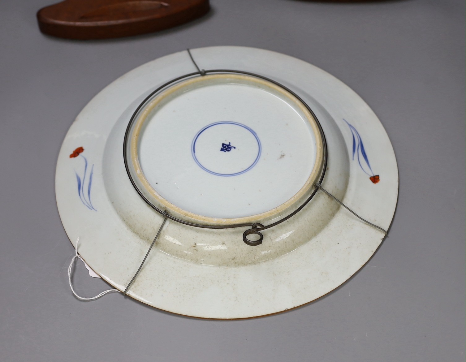 A pair of Chinese Imari dishes, Kangxi period, on wooden stands, 31 cms diameter., Provenance - D.C.Monk & Son, former dealers based in Kensington Church Street, London W8